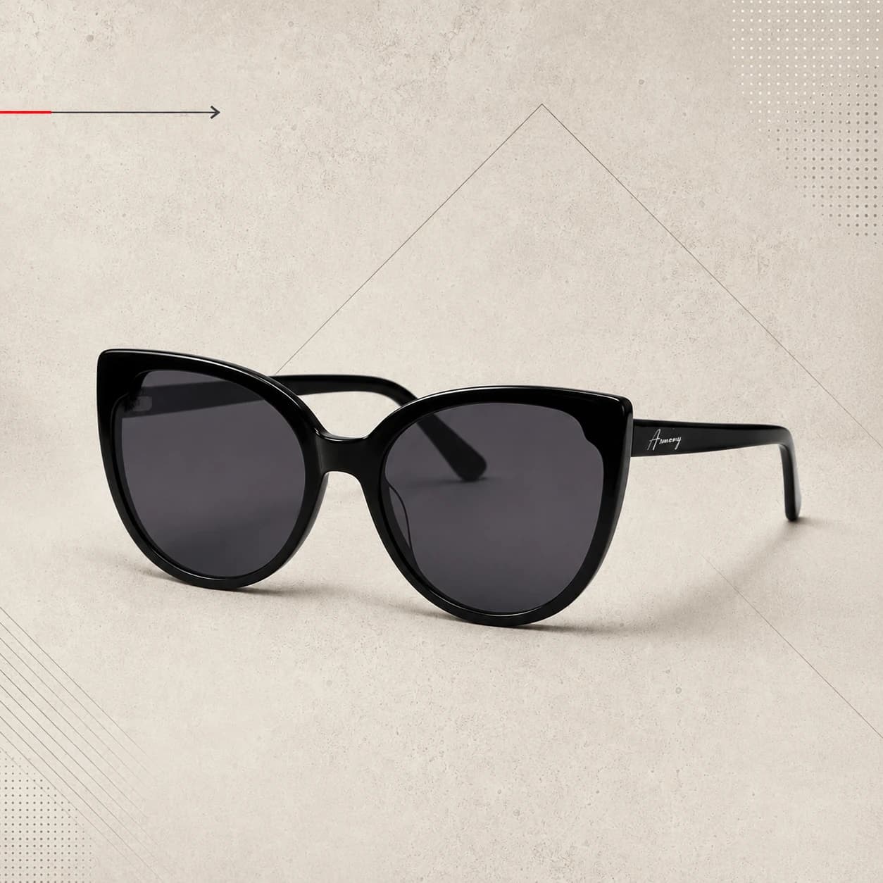 Glossy black cat-eye sunglasses on a warm textured geometric background