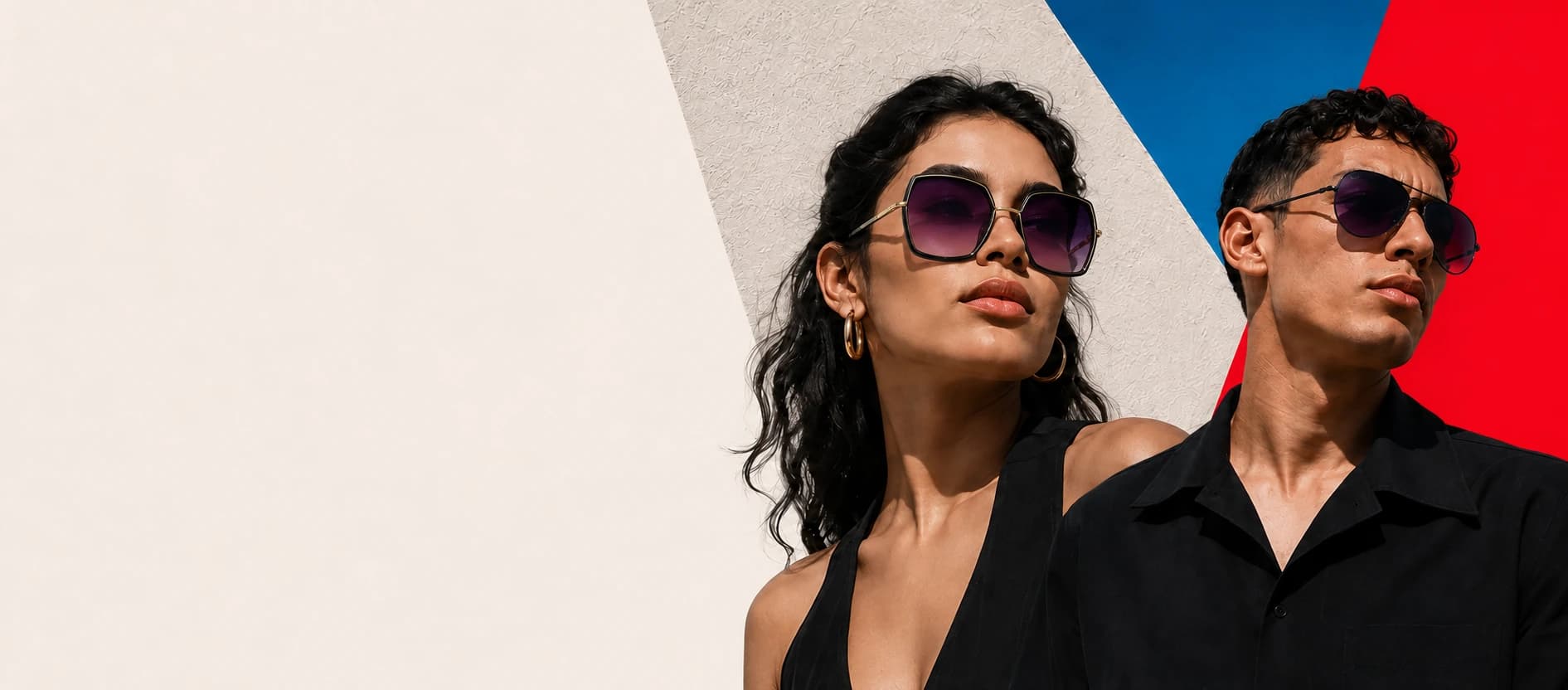 Two models wearing black sunglasses in a geometric Numyra campaign setting